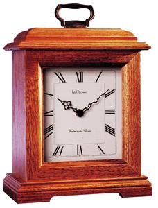 River City Clocks 3101O Small Bracket Clock, Solid Oak Case with Medium Oak Finish; Movement German Quartz movement features 4/4 Westminster or Ave Maria Chime; Power Two 