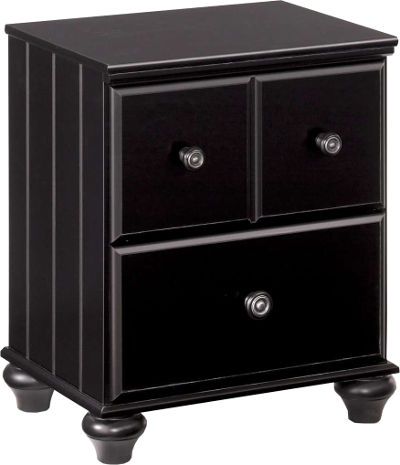  Ashley B150-92 Jaidyn Series Two Drawer Night Stand, Replicated black paint, Large turned wood knobs with decorative pewter finished metal rosette inserts, Side roller glides for smooth operating drawers, Dimensions 21.97
