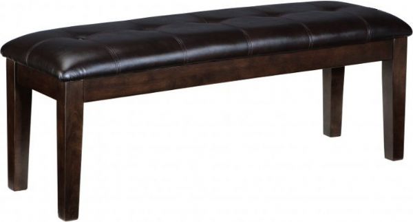 Ashley D596-00 Haddigan Series Large Upholstered Dining Room Bench; Made with select Oak veneers and hardwood solids with a dry smoky dark brown oak color; Edges and corners have a rounded off, worn effect for a casual look; Tufted bench is cover with polyurethane material available in dark brown; Dimensions 49.50