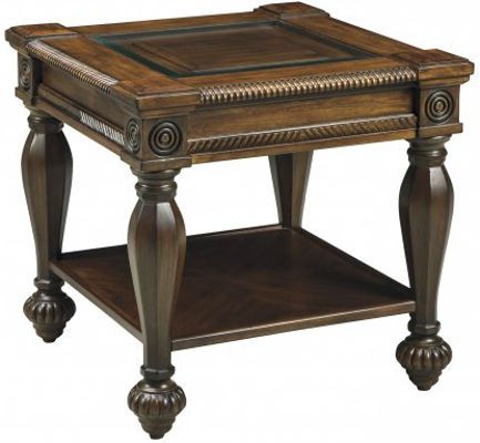 Ashley T616-2 Mantera Series Square End Table; Rich brown finish; Constructed with select veneers and hardwoods; Shapely turned and chamfered posts with deep reeded details; Framed and overlaid ornamentation; Framed, raised panels shown through clear glass top insert with beveled and polished edges; Dimensions 26