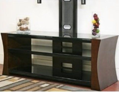 Wholesale Interiors BY-FW1270X Spaulding Modern TV Stand with Integrated Mount, Antiqued cherry veneer finish brings warmth to your decor, Three black tempered glass shelves add sophistication, Integrated black powder-coated steel mount fits a variety of flat panel TV sizes - maximum 57