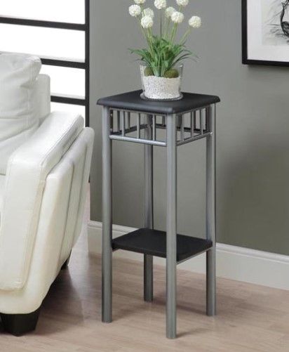 Monarch Specialties I 3094 Black/Silver Metal Plant Stand; With its modern black finished top, this plant stand gives a warm feel to any room; Silver colored metal base, with a criss-cross motif, provides sturdy support as well as an elegant look; Use this multi- functional stand to place your favorite plant, and its lower shelf to display decorative pieces; UPC 021032258221 (I3094 I-3094)