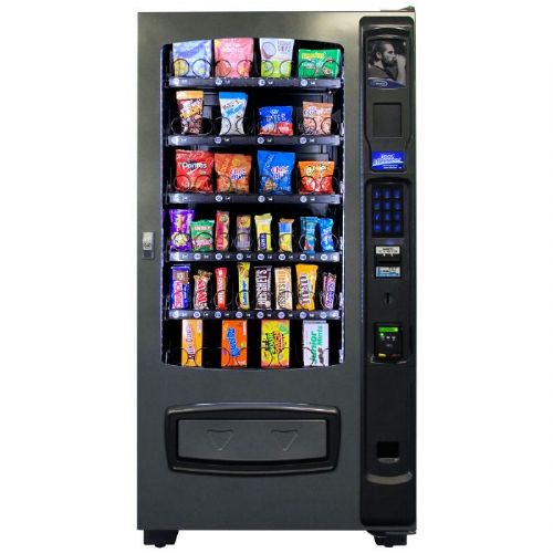 Seaga ENV4S Snack Vending Machine; Convertible shelving; Removable trays with first in/first out (FIFO) product loading capability; Over-sized product bin for larger products; Dual spirals standard in two trays; Dual coils are standard; All metal adjustable product trays tilted thirty degrees for simplified servicing; Easy-to-read 2-line 20 character VFD; Display completely programmable; Braille equipped telephone-type keypad (SEAGANV4S SEAGA ENV4S VENDING MACHINE) 