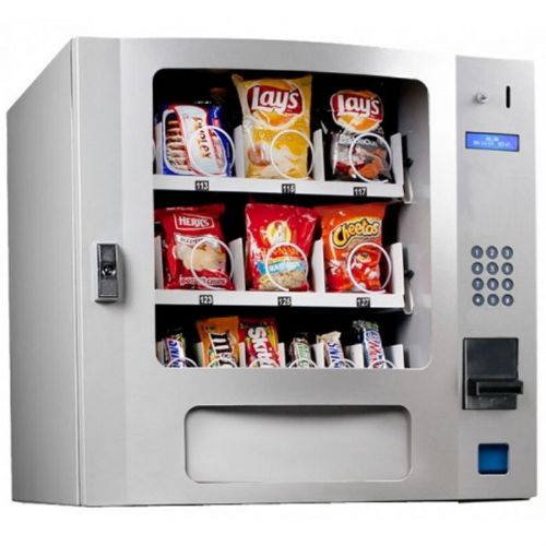 Seaga SM16S Snackmart Tabletop Silver Vending Machine with Changer and Bill Acceptor; Includes electronic coin changer and $1, $5, $10, $20's bill acceptor/validator; Programmable controller allows individual pricing for each selection; Full function four character LED displays pricing, deposit quantity and selection data; MDB electronics feature internal vend counter, automatic machine testing and DEX capability(SEAGASM16S SEAGA SM16S VENDING MACHINE)